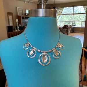 Silver toned statement necklace.